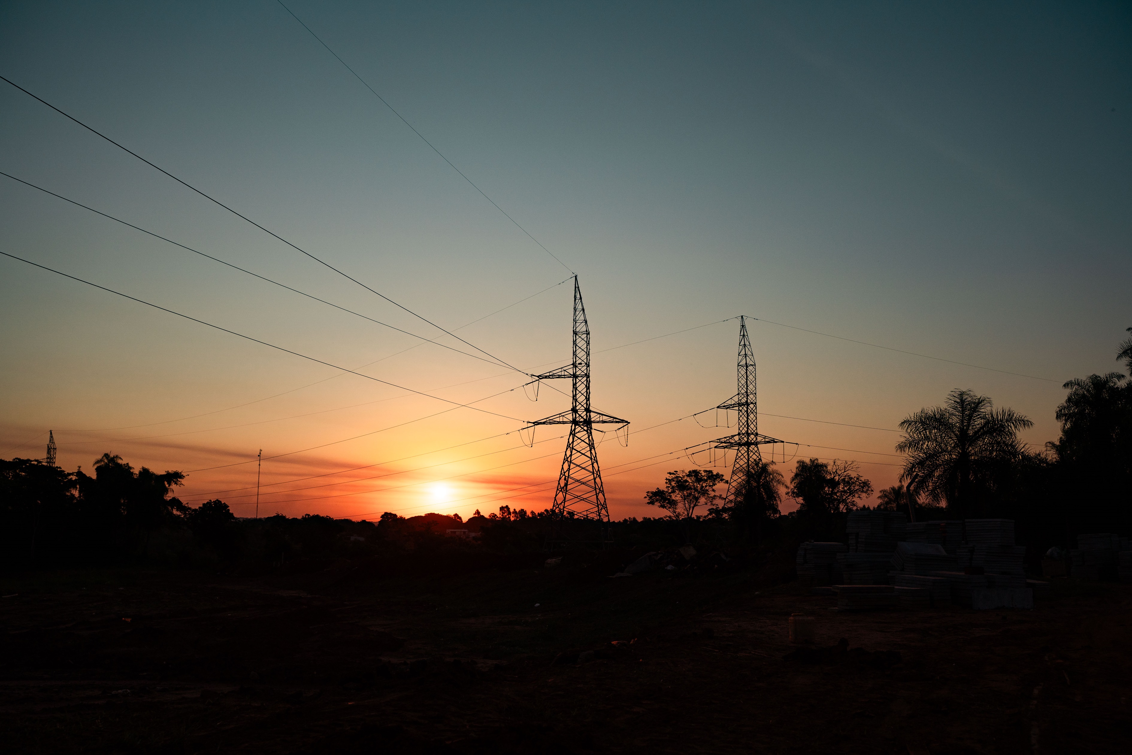 Image of sunset and electrical lines.